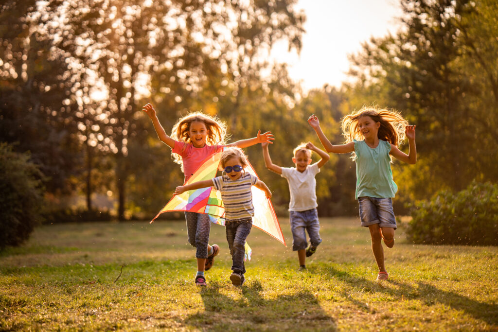Group of happy children playing together